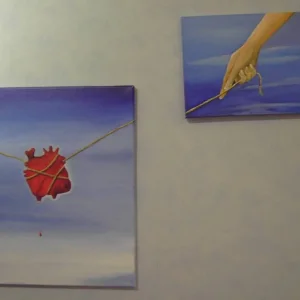 Ein Herz, gefangen in Seilen, welches jeden Moment abstrzen knnte